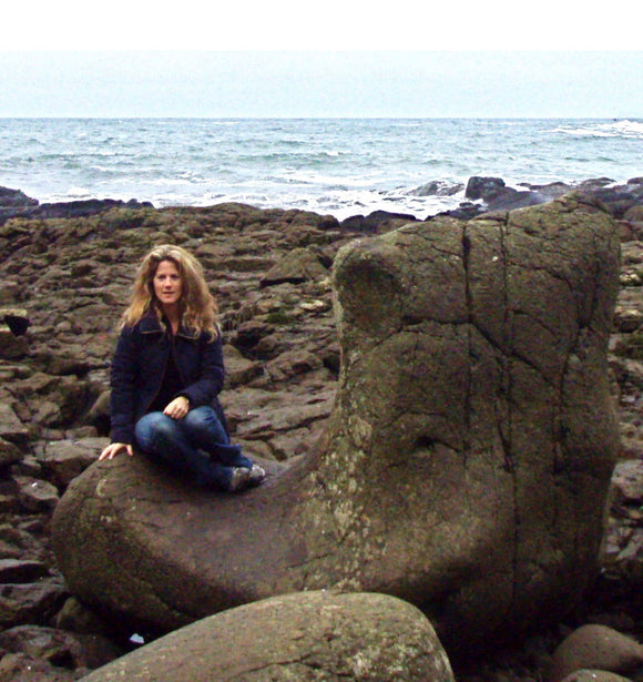 Sitting on the 'Giant's Boot ', at the Giant's Causeway - Northern Ireland's Unesco Heritage Site.